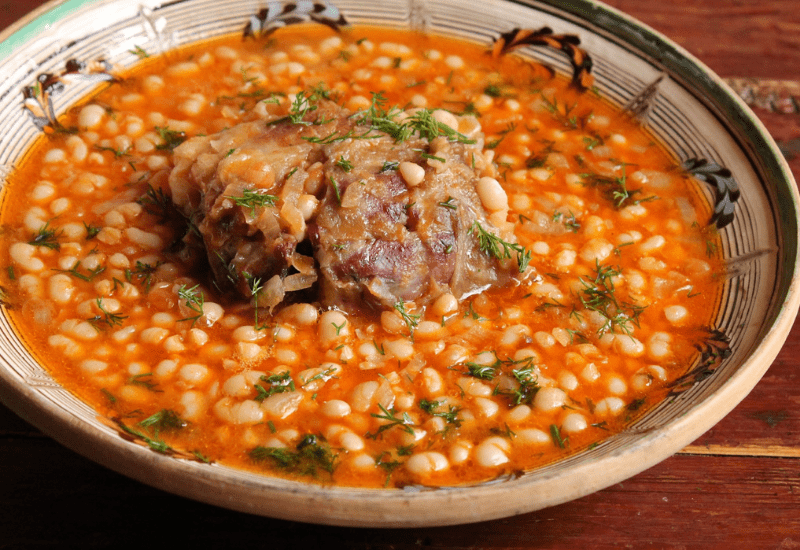Traditional Romanian Dishes CIORBĂ DE FASOLE CU CIOLAN (Bean Soup With Smoked Ham Hock)