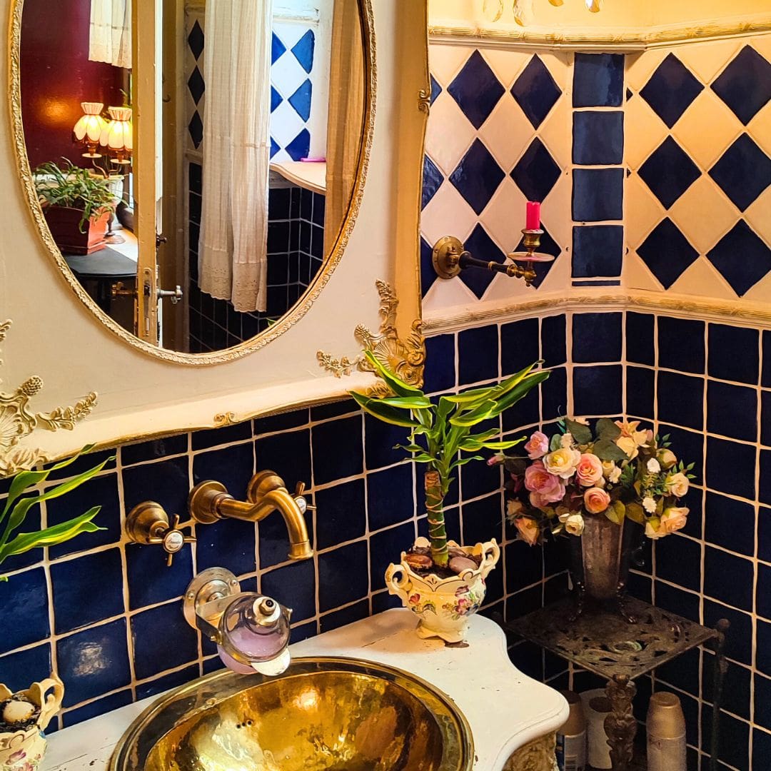 blue chic decorated bathroom in Little Paris Museum
