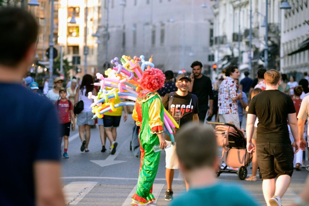 Clown offering flowers during Opens Streets in Bucharest
